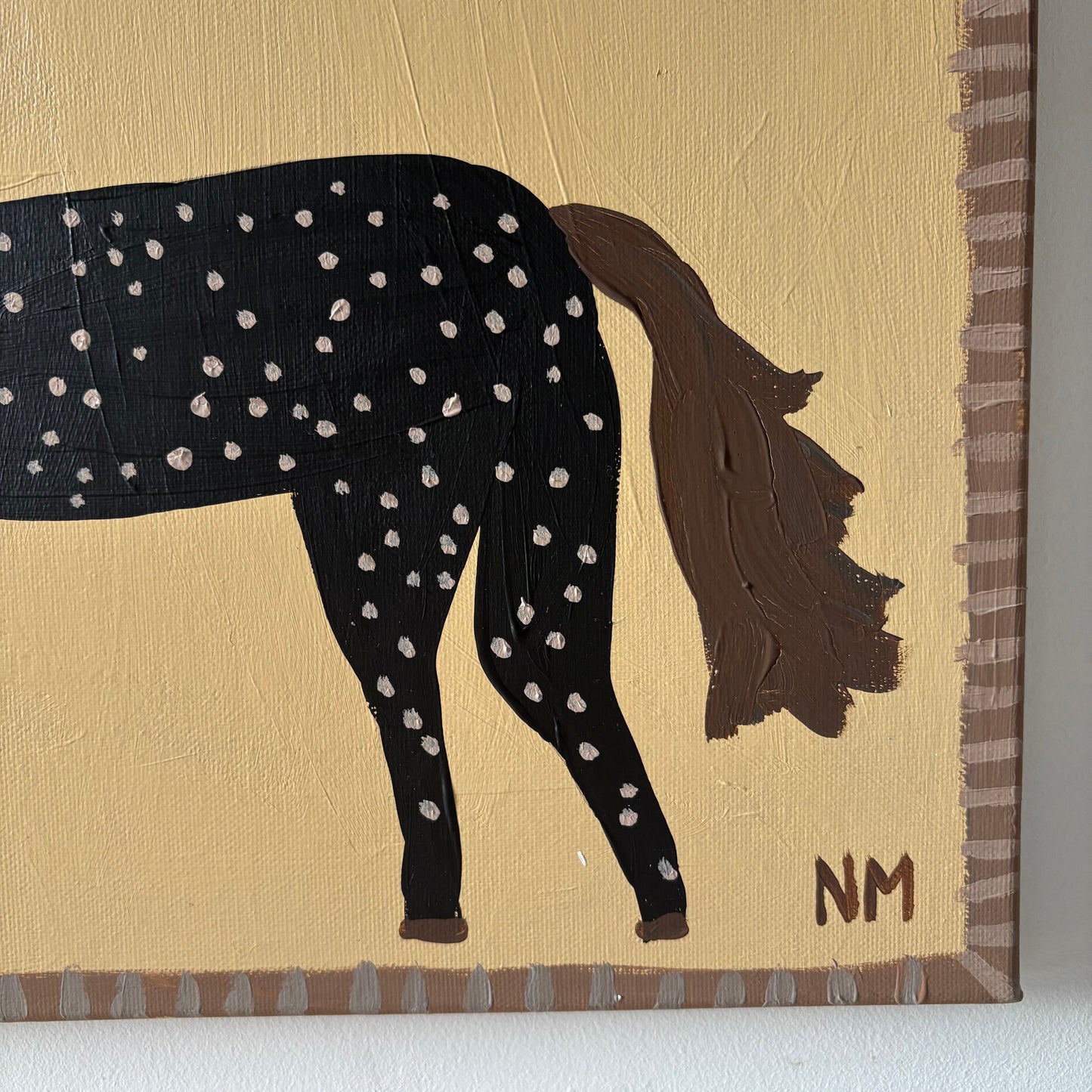 Two spotty horses.
