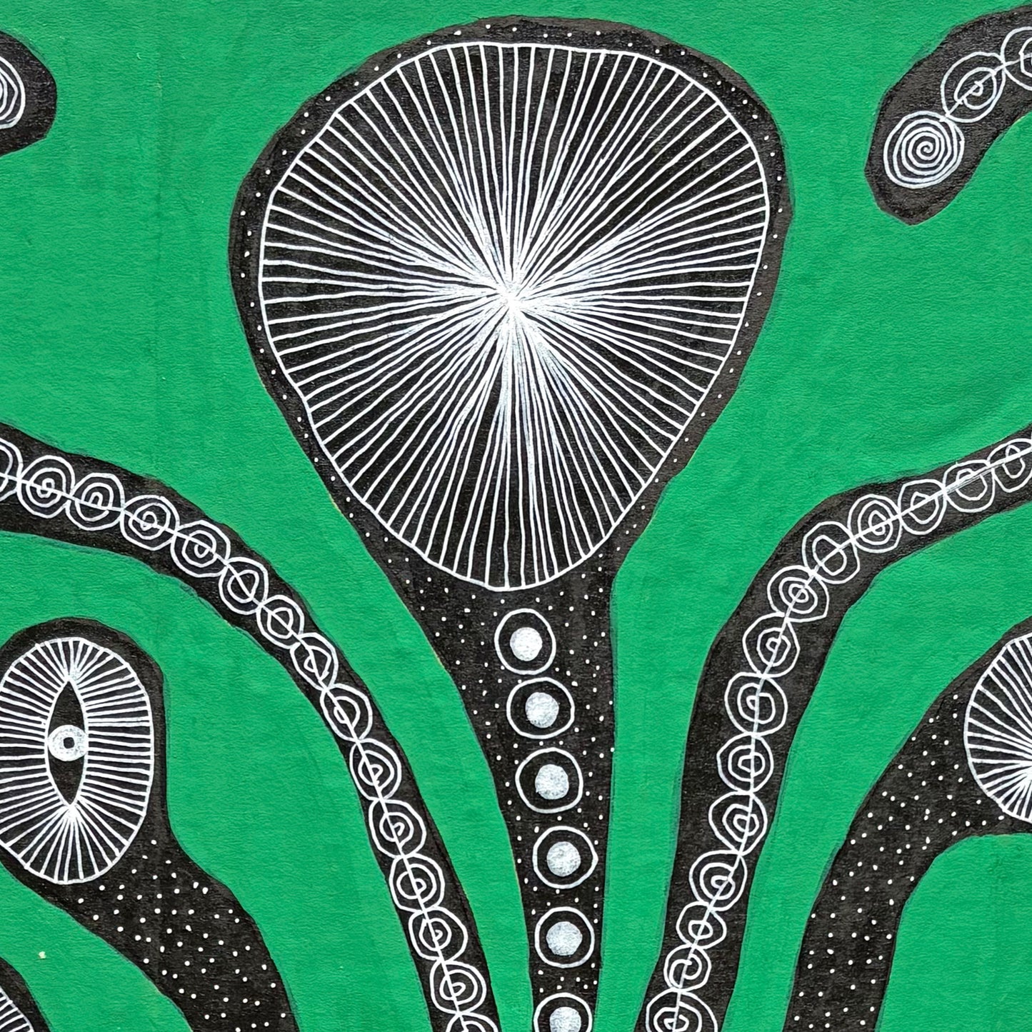 Black flower on green.