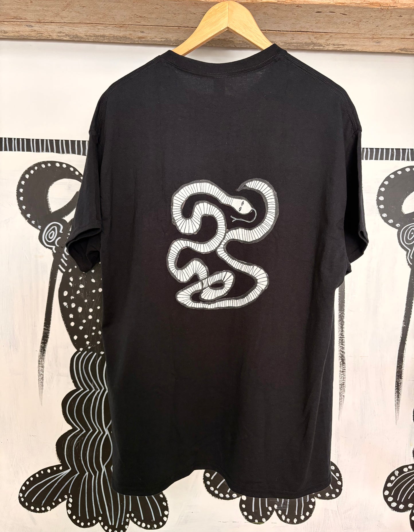 White snake T-shirt.
