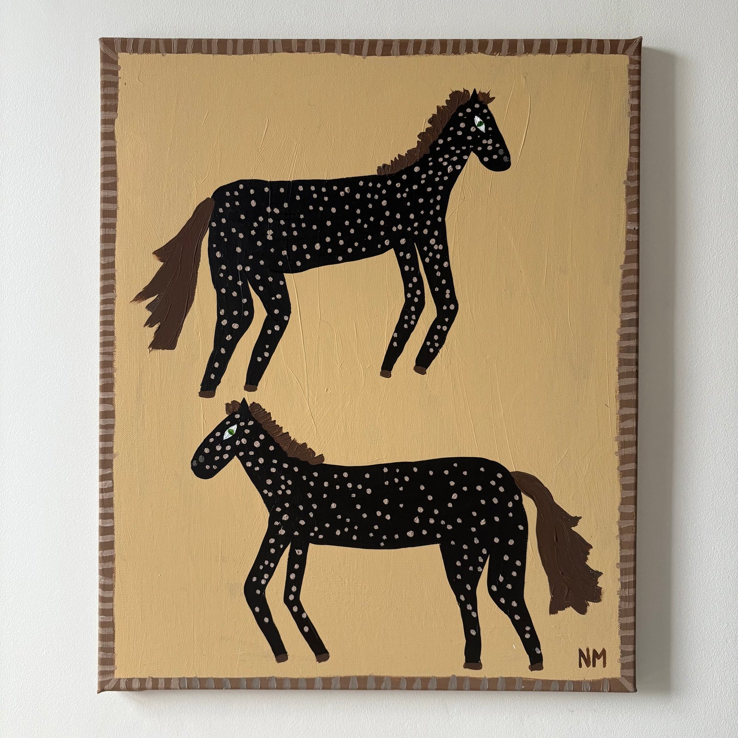 Two spotty horses.
