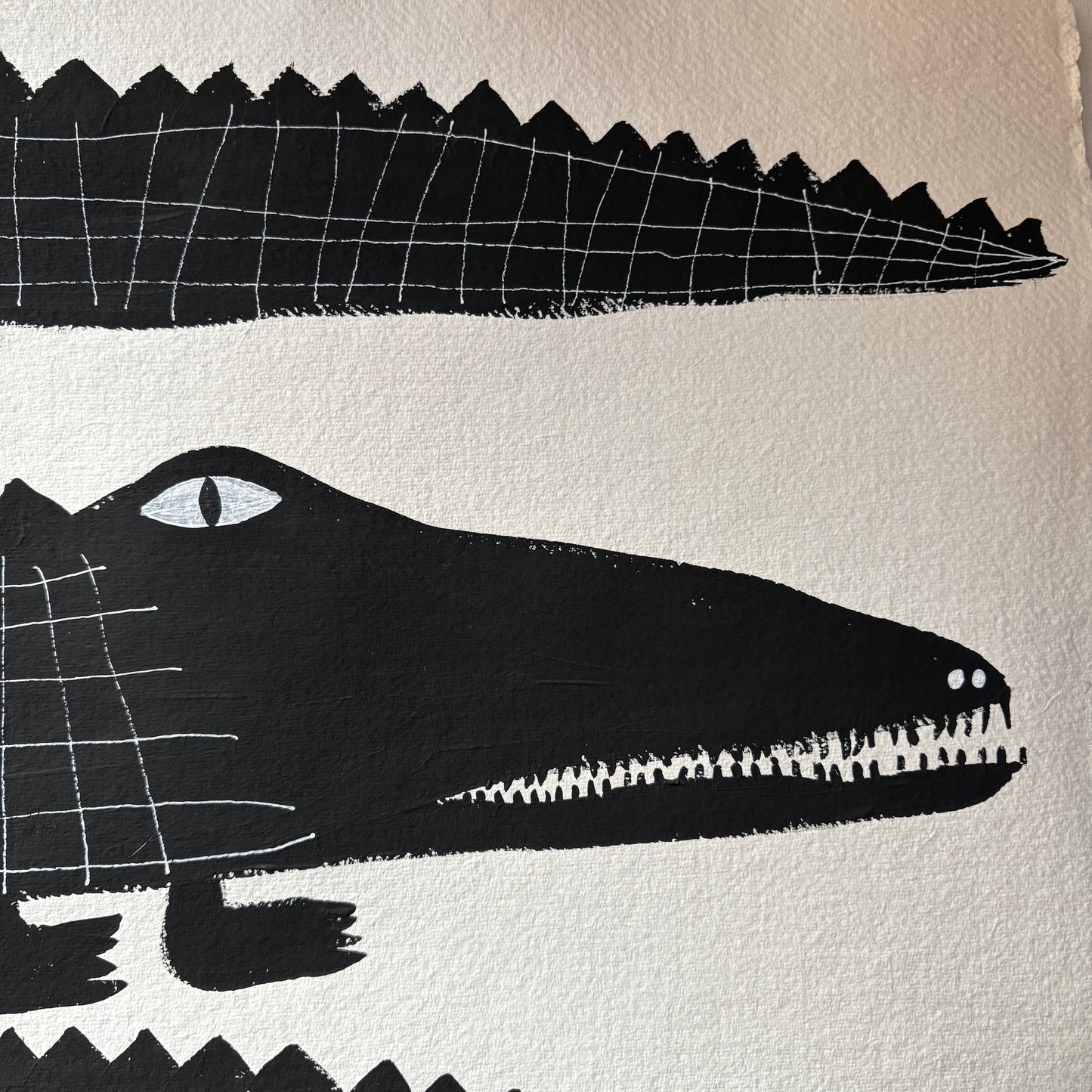 Three black crocodiles.