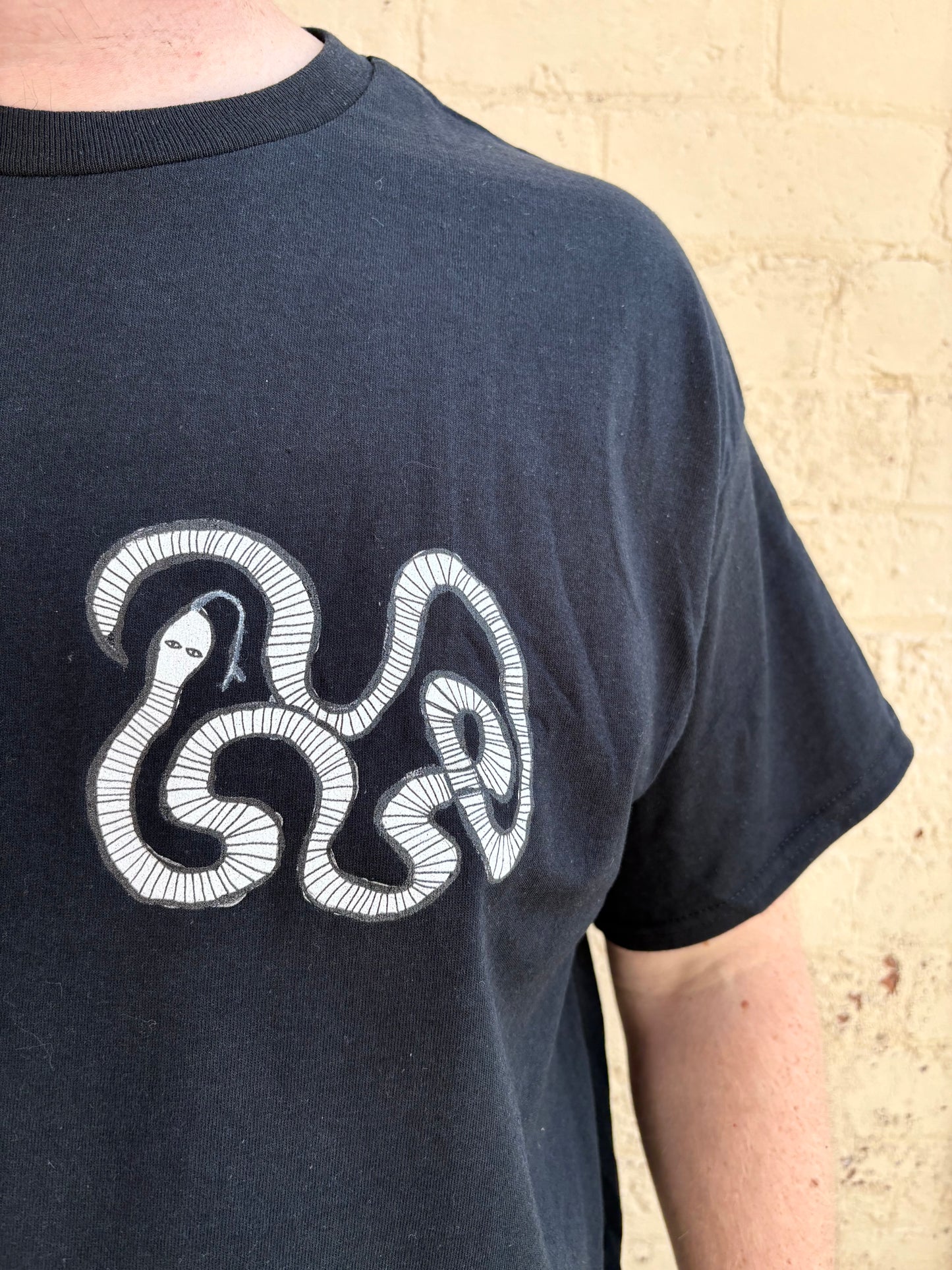 White snake T-shirt.