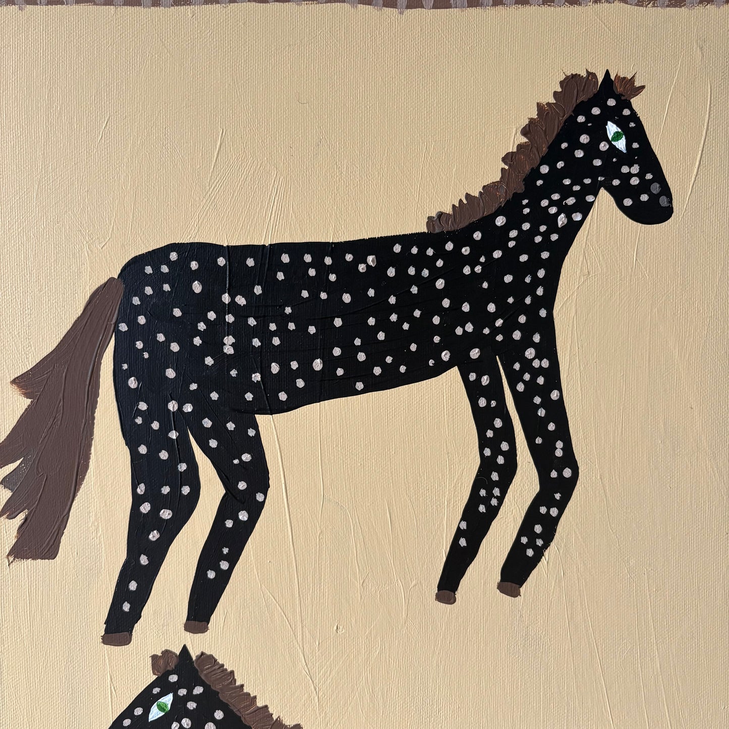 Two spotty horses.
