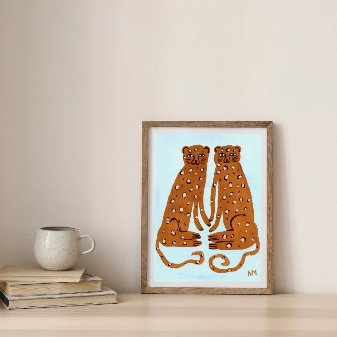 Two leopards on blue print.