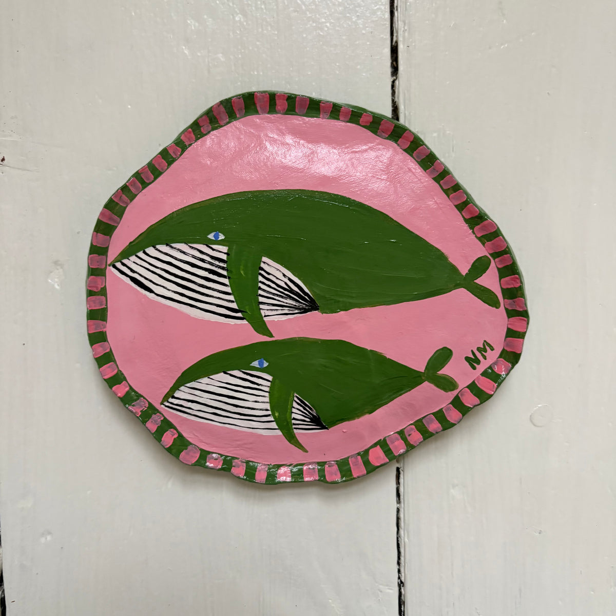 Green whale wall hanging.