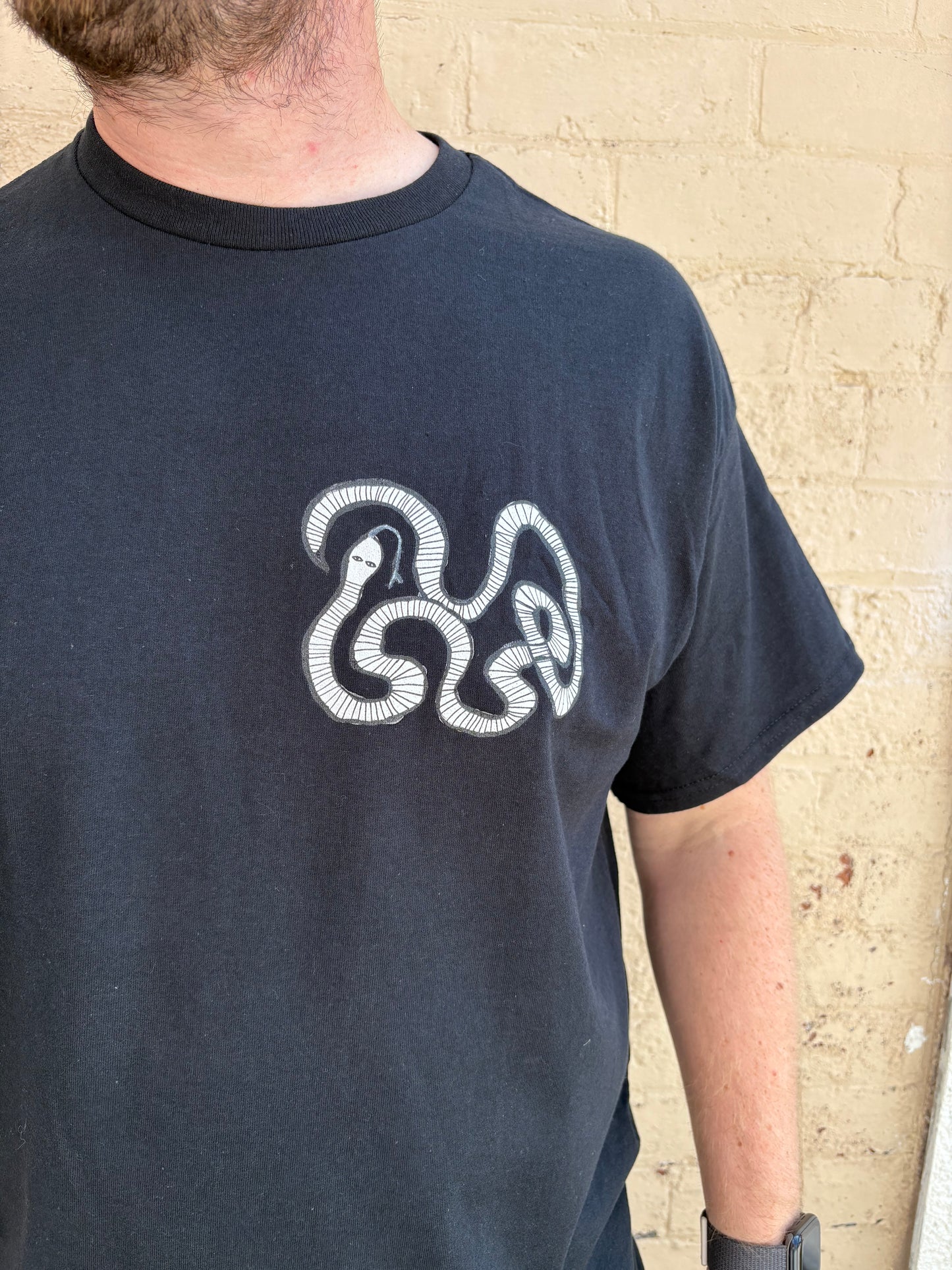 White snake T-shirt.