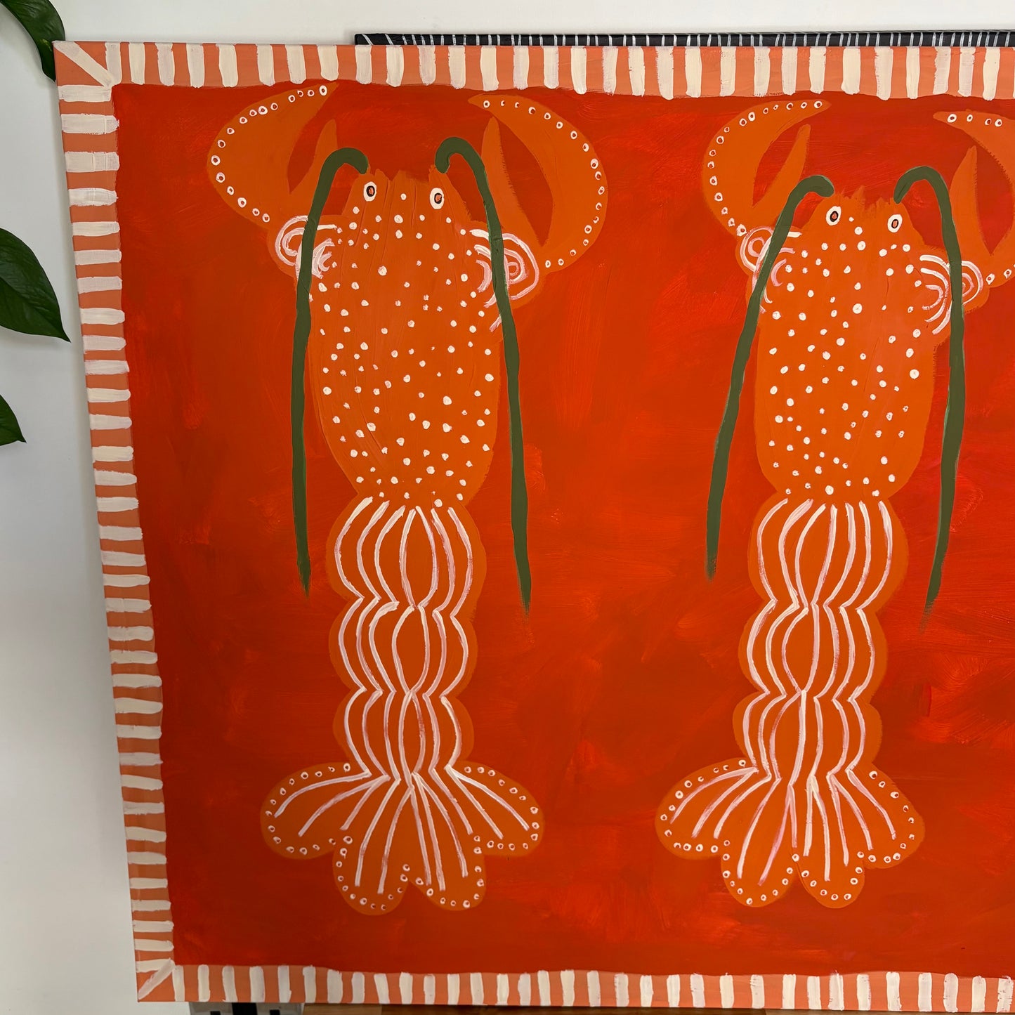 Three orange lobsters.