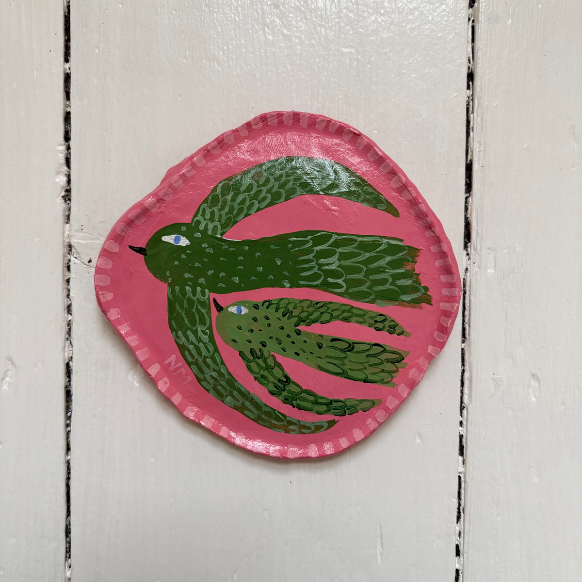 Two green birds wall hanging.