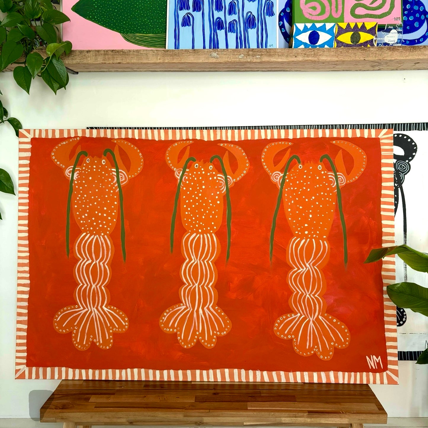 Three orange lobsters.