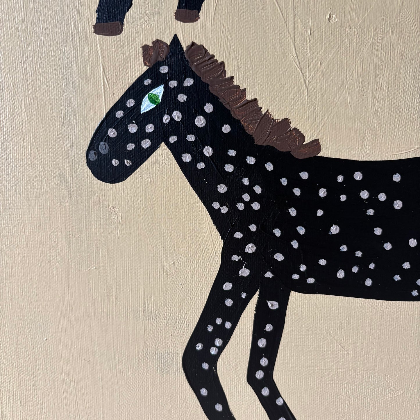 Two spotty horses.