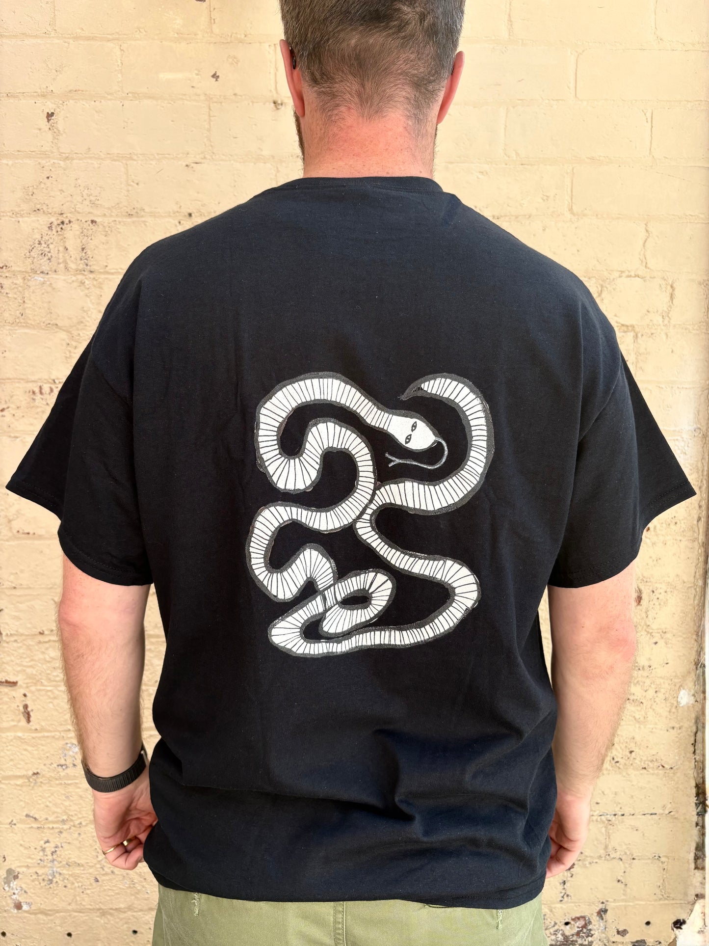 White snake T-shirt.