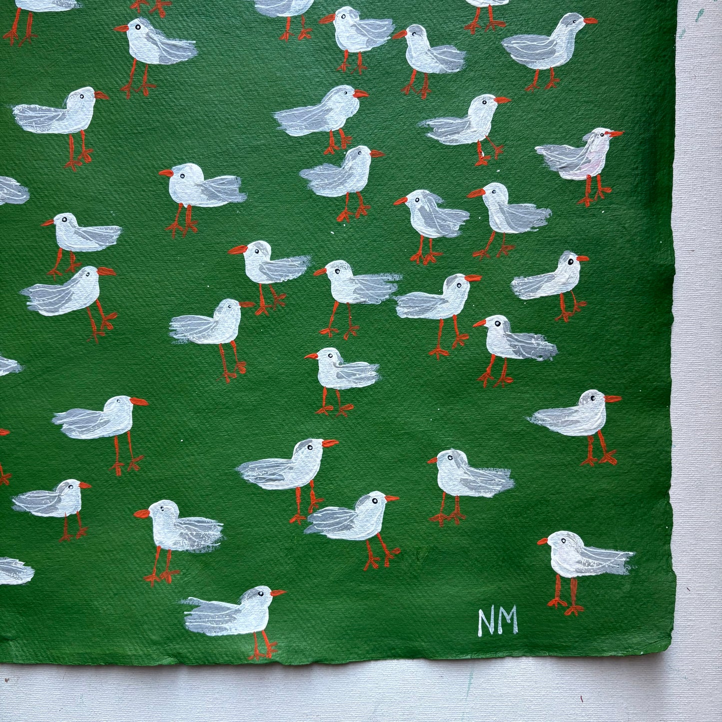 Seagulls on green.
