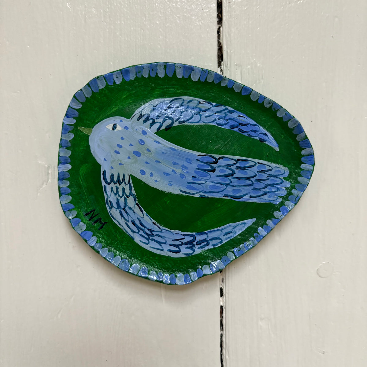 Blue bird wall hanging.