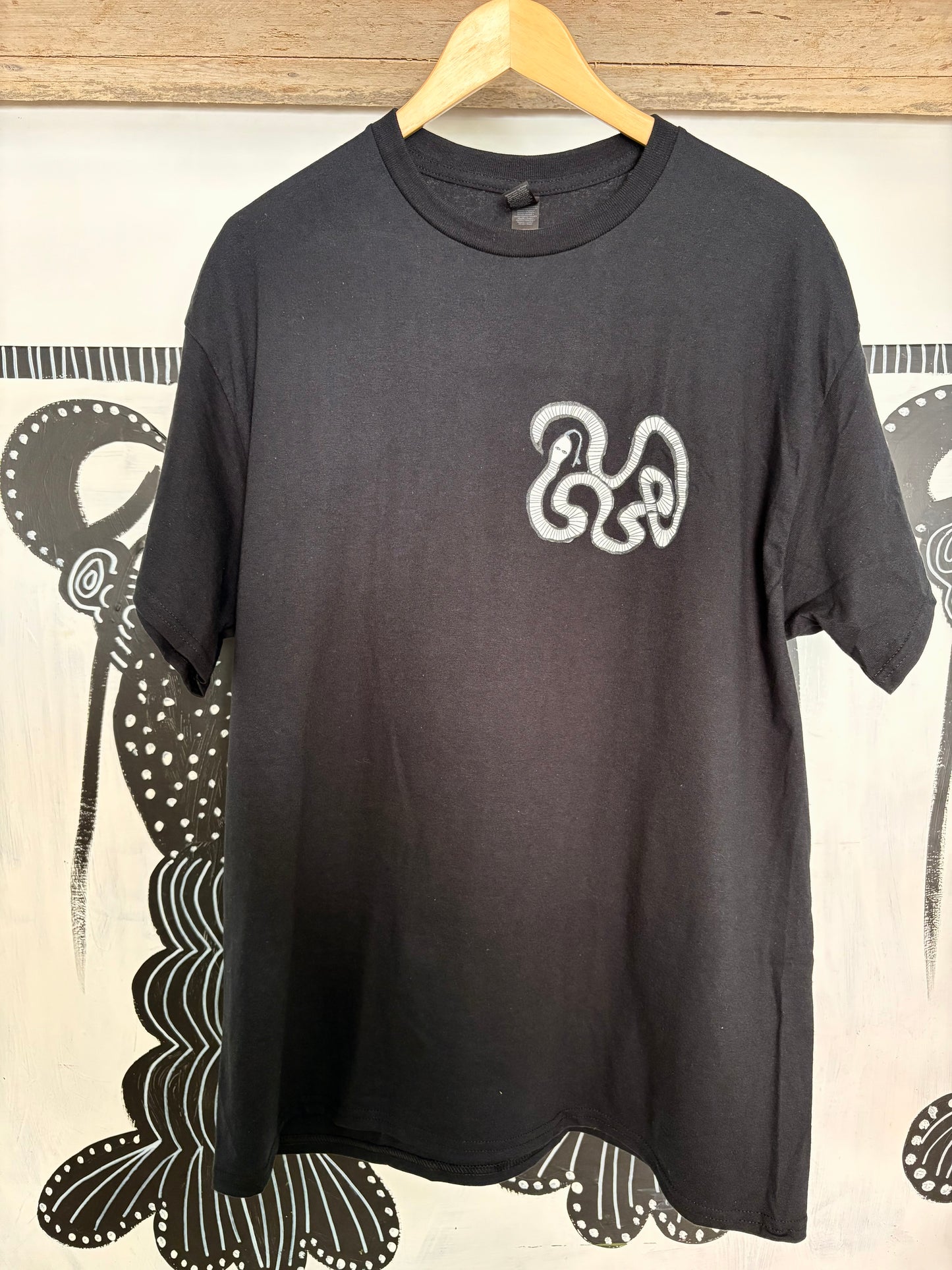 White snake T-shirt.
