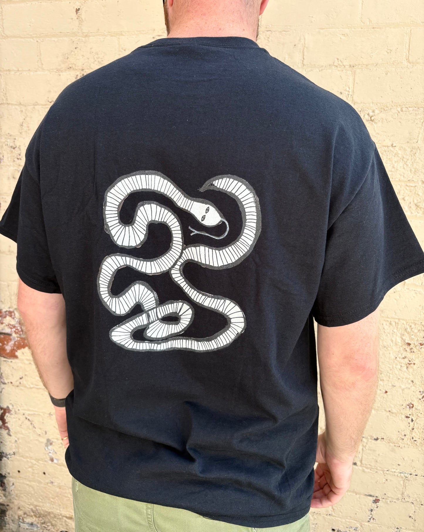 White snake T-shirt.