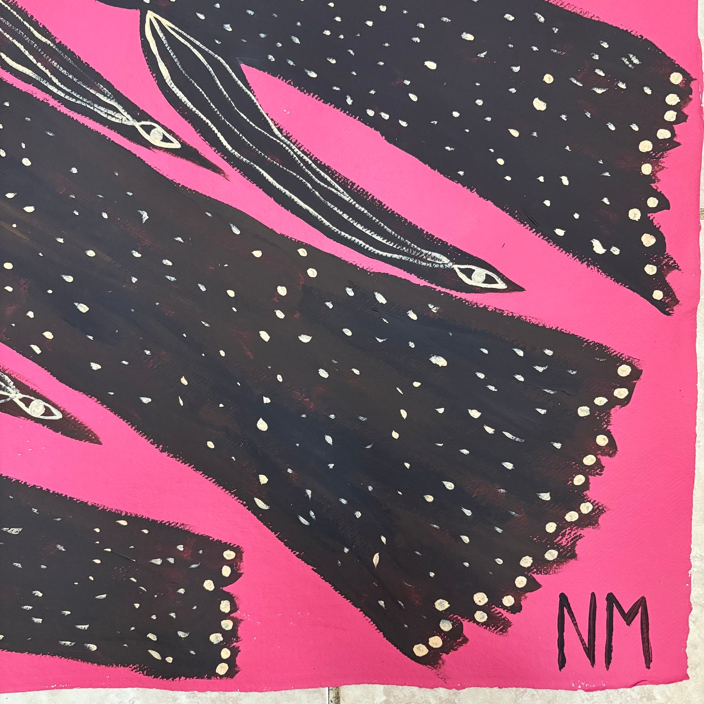 Birds flying in the pink sky.