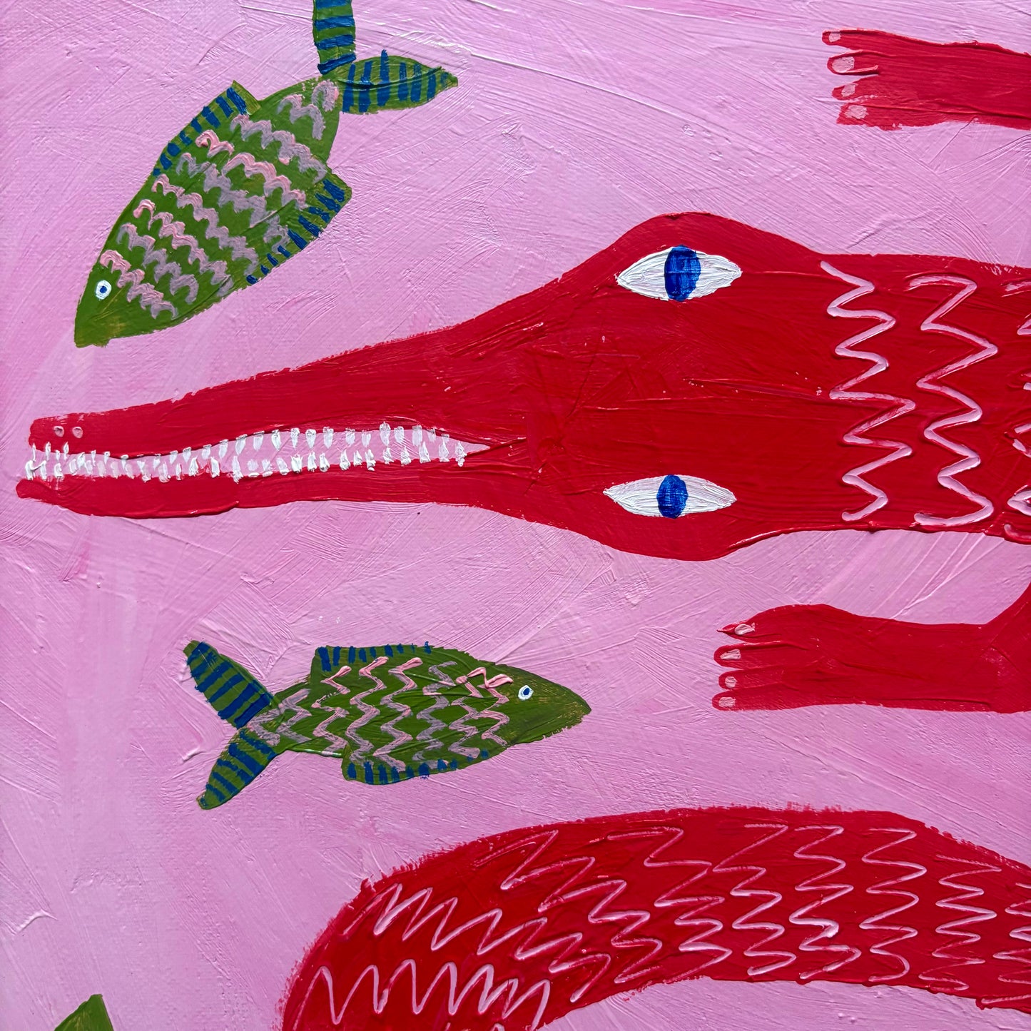 Red crocodile in the pink sea.