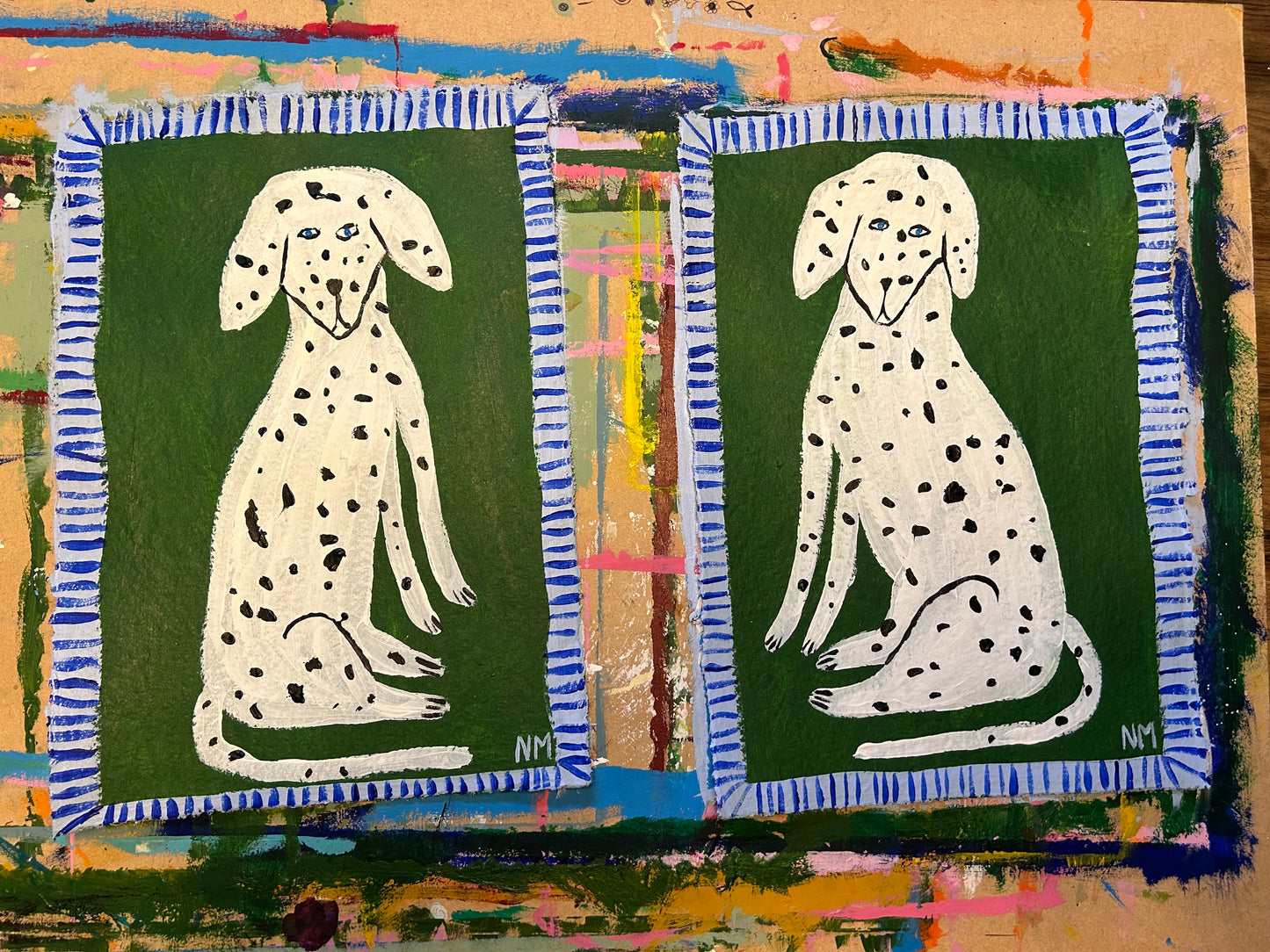 Two Dalmatians on green