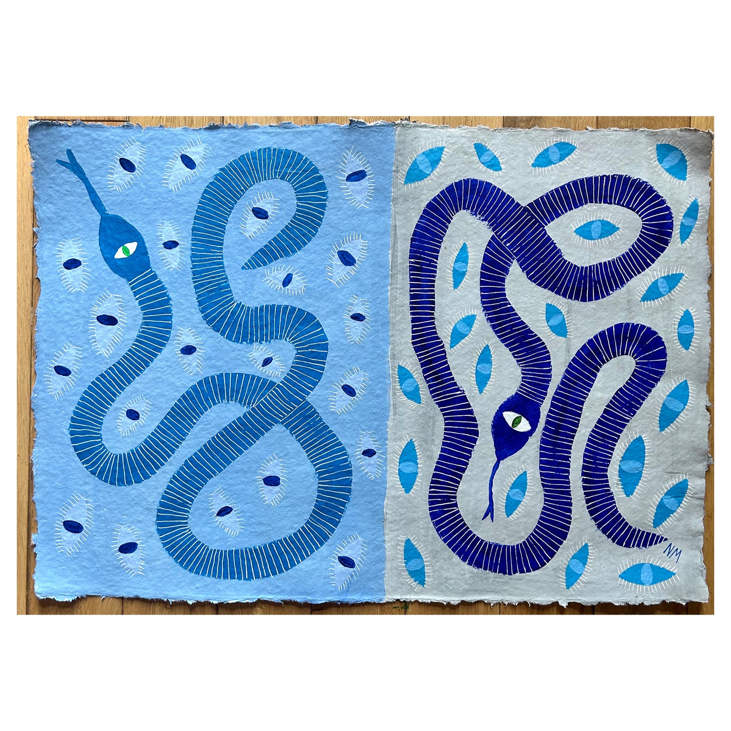 Two blue snakes with eyes