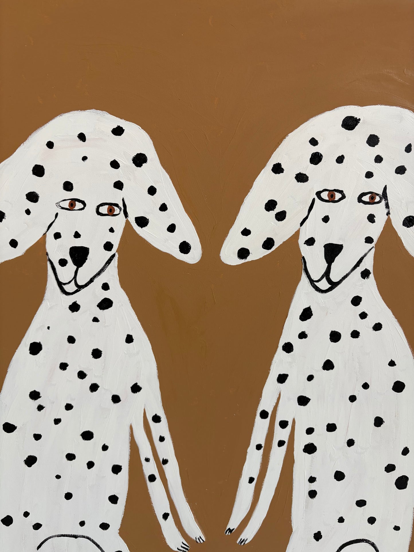 Sitting Dalmatians.