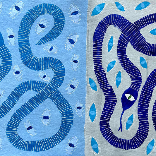 Two blue snakes with eyes