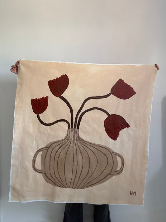 Red tulips in the vase.