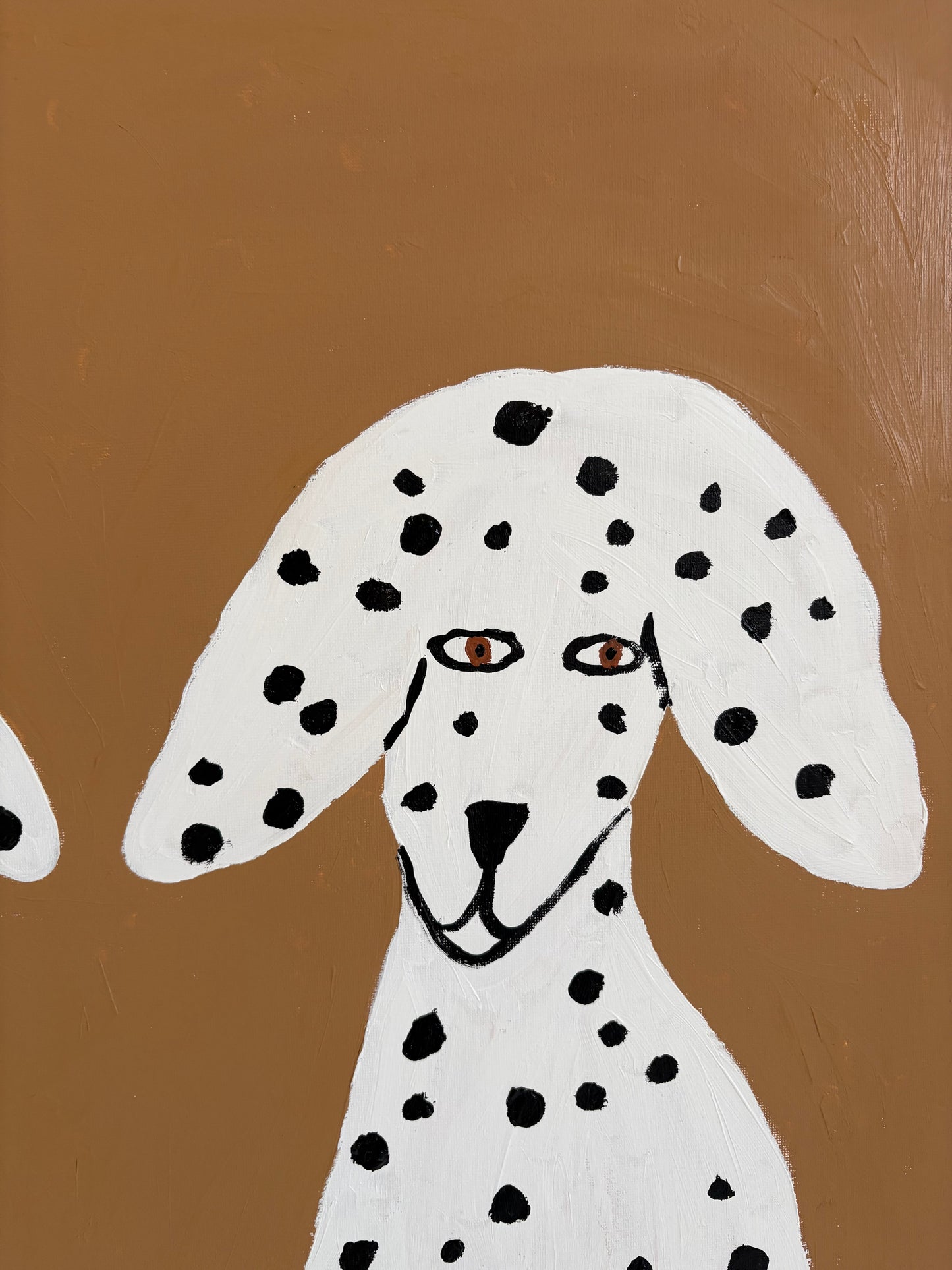 Sitting Dalmatians.