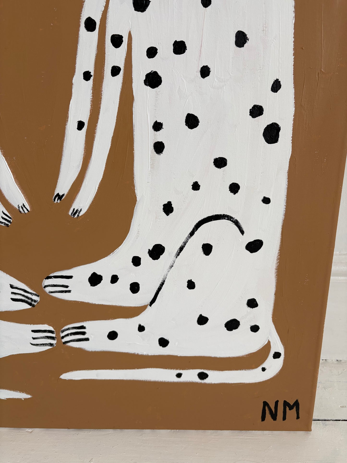 Sitting Dalmatians.