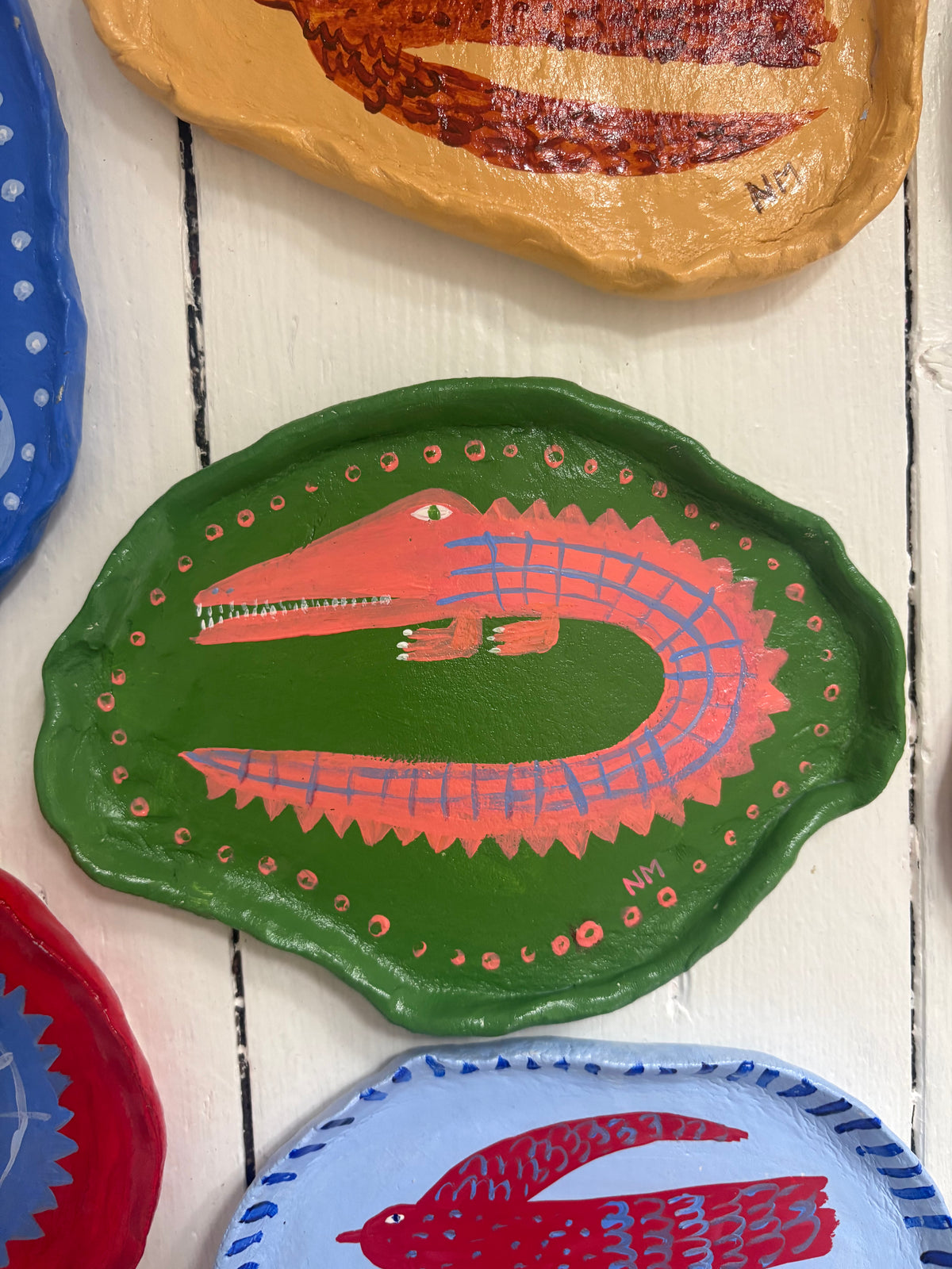 Pink crocodile wall plate.
