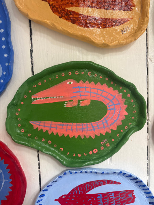 Pink crocodile wall plate.