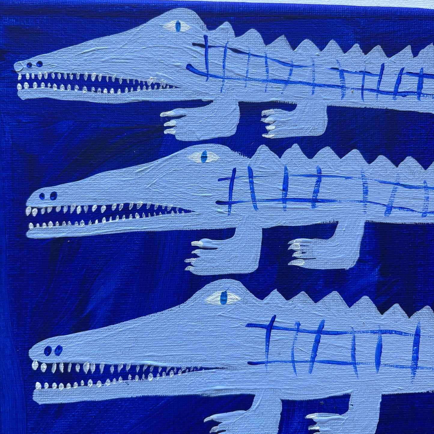 Three blue crocodiles.