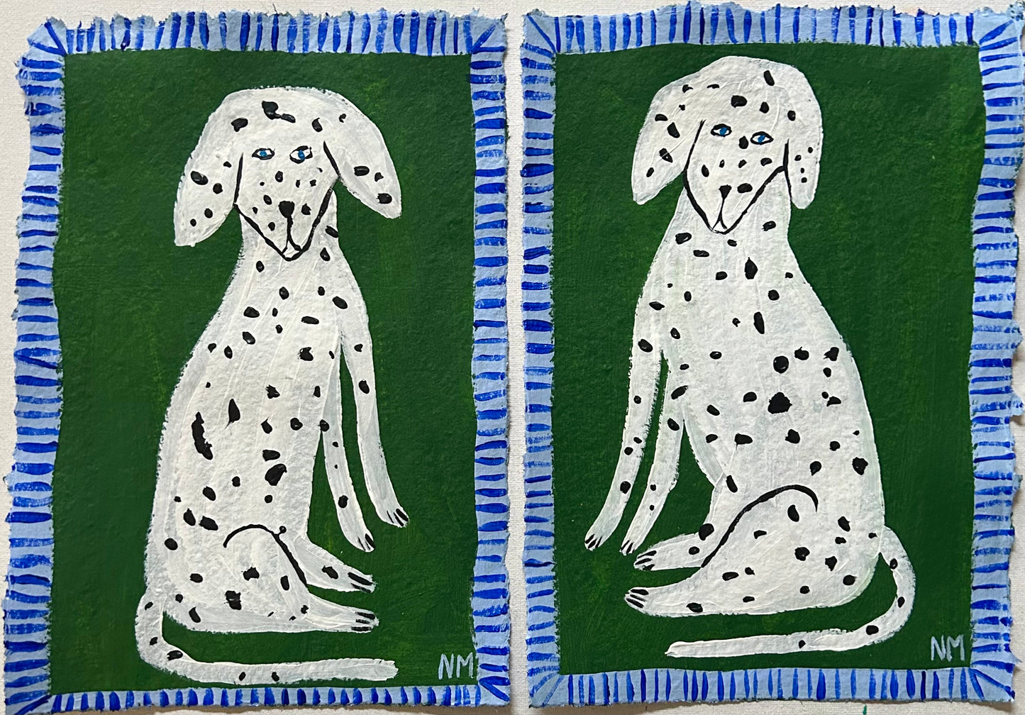 Two Dalmatians on green