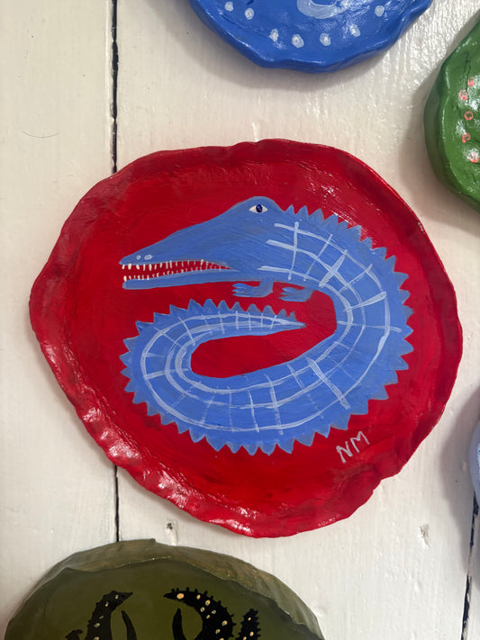 Blue crocodile wall plate.