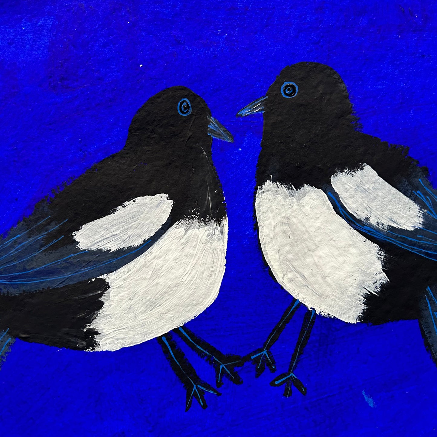 Magpies on blue