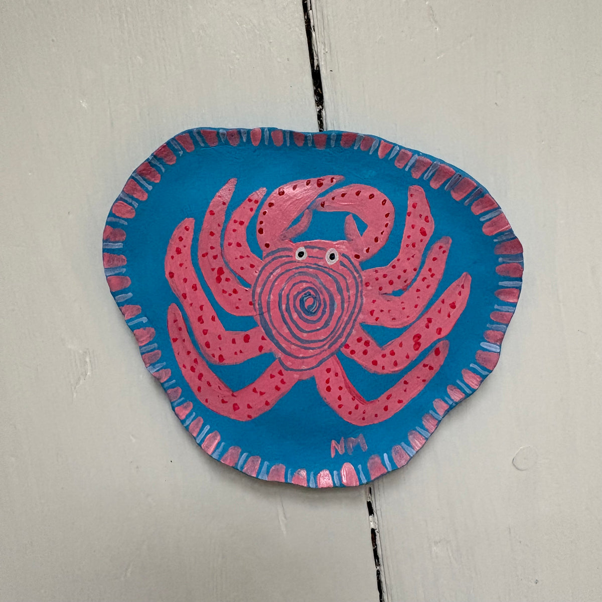 Pink crab wall hanging.