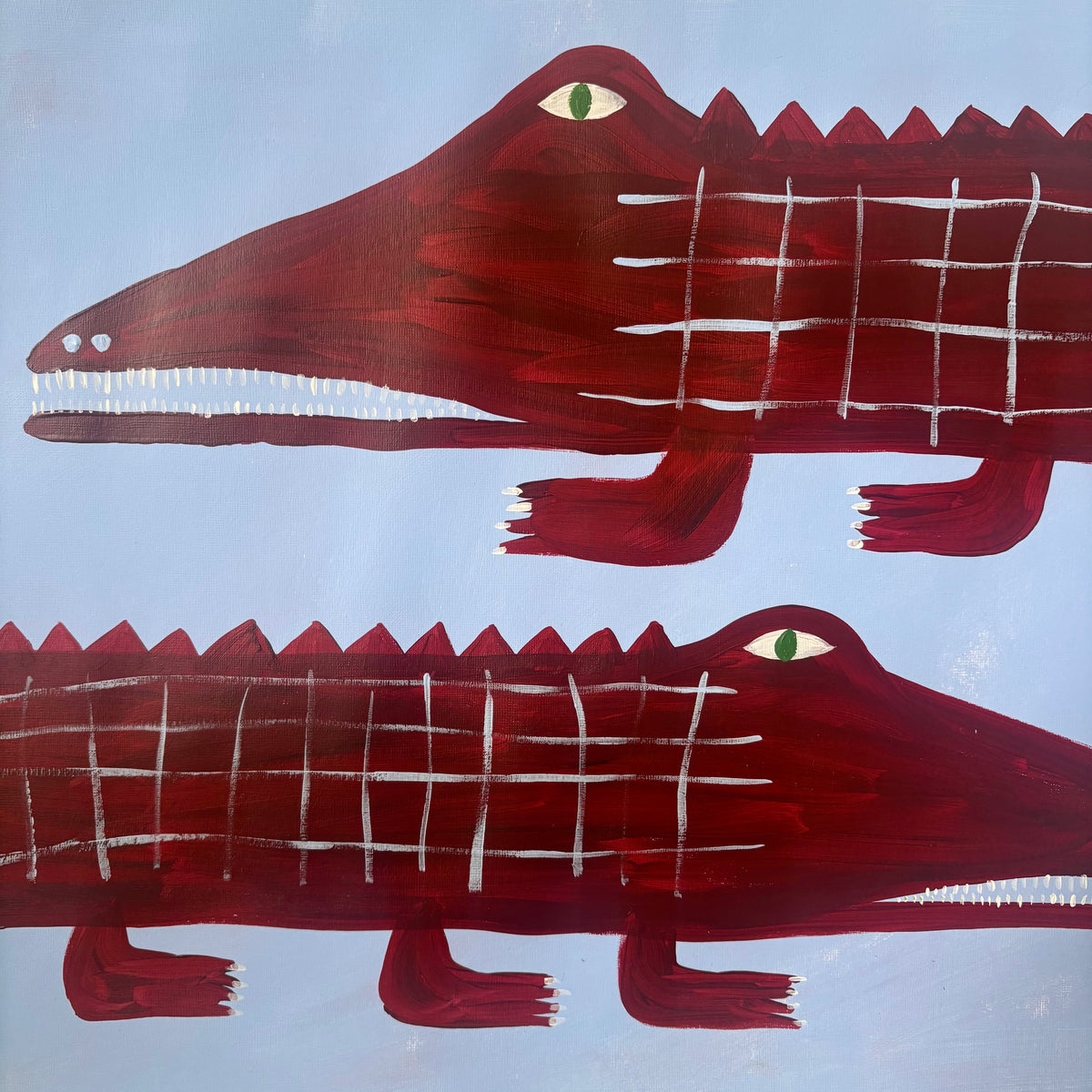 Two red crocodiles.