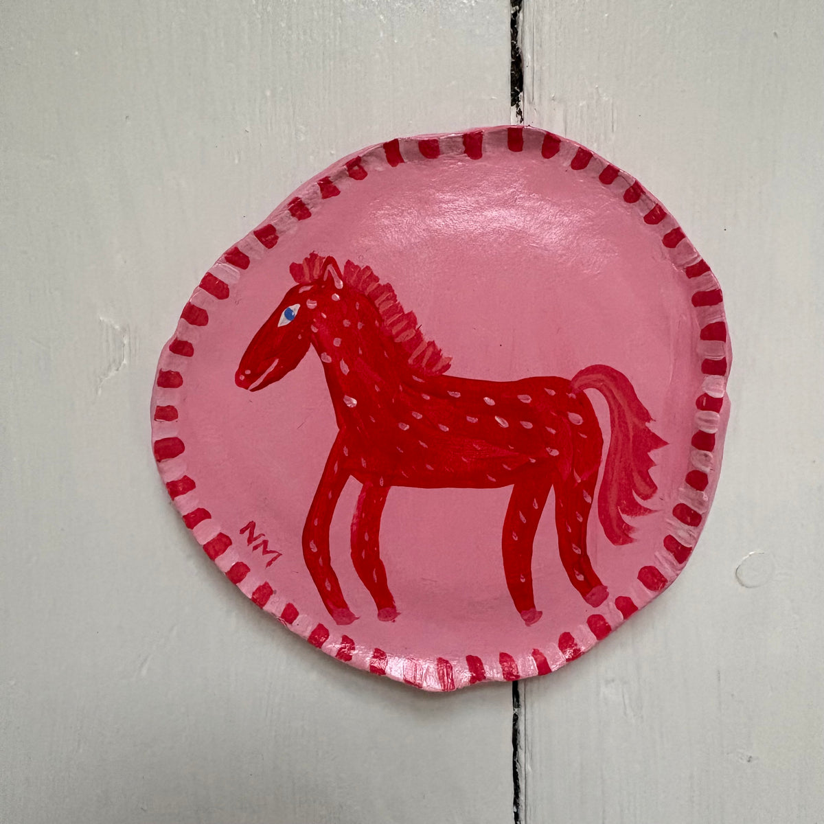 Red horse wall hanging.