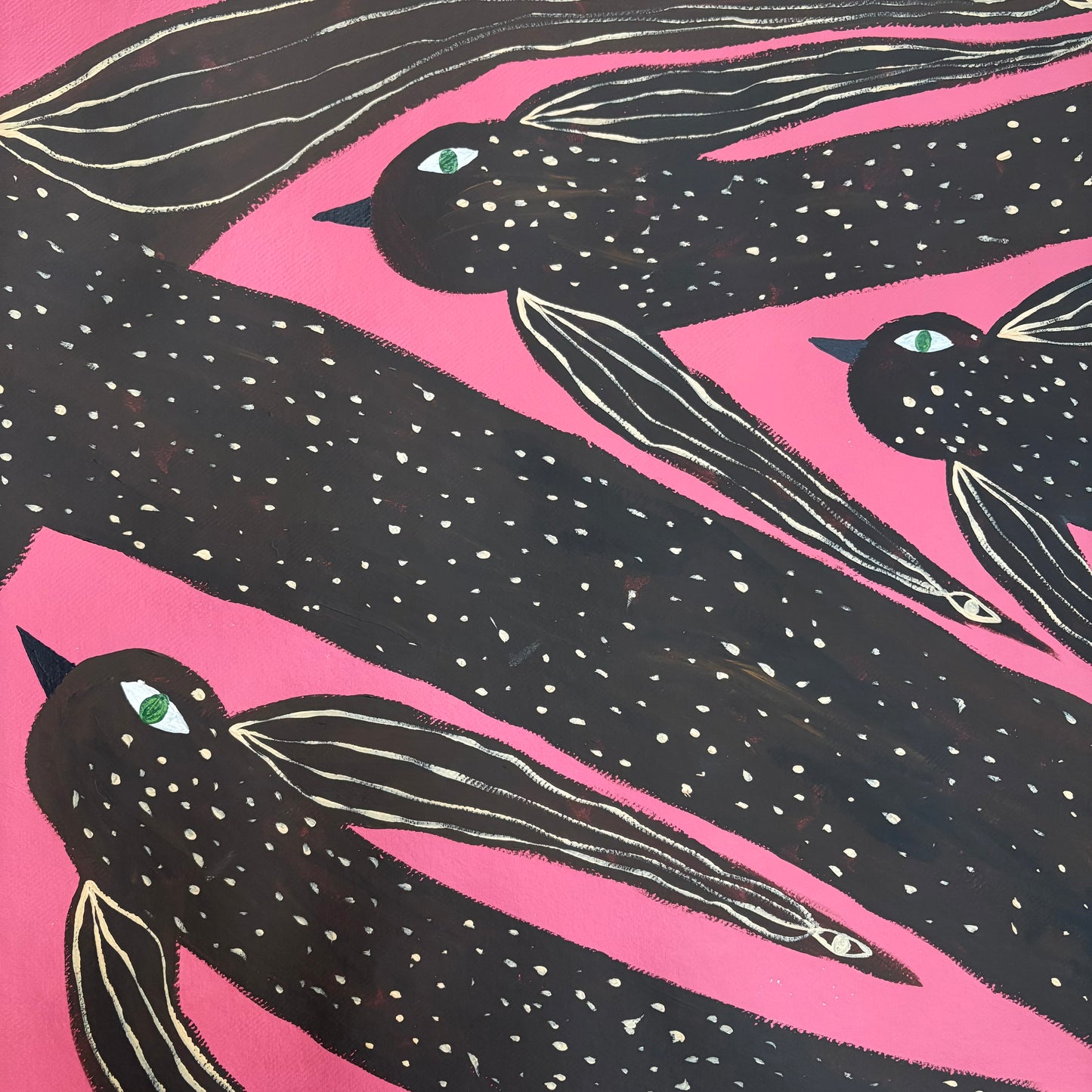 Birds flying in the pink sky.