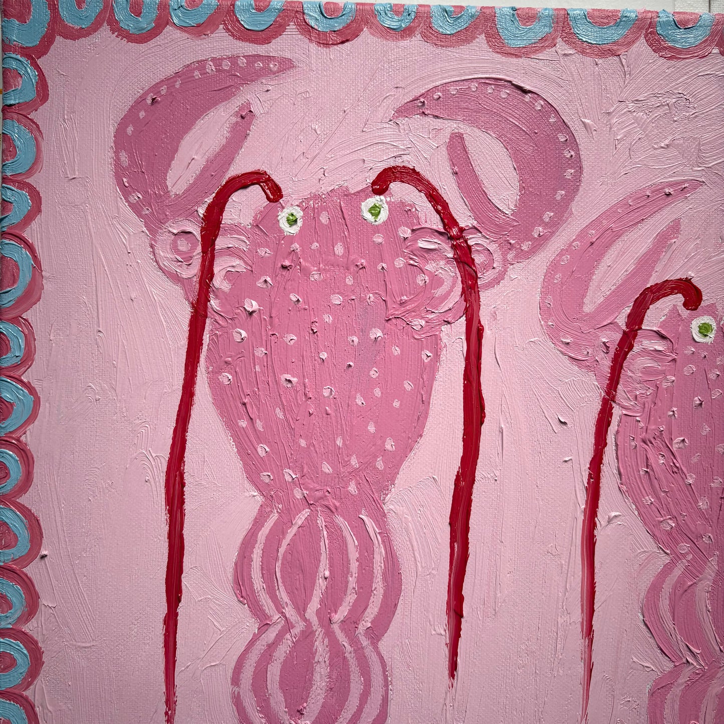 Three pink lobsters.