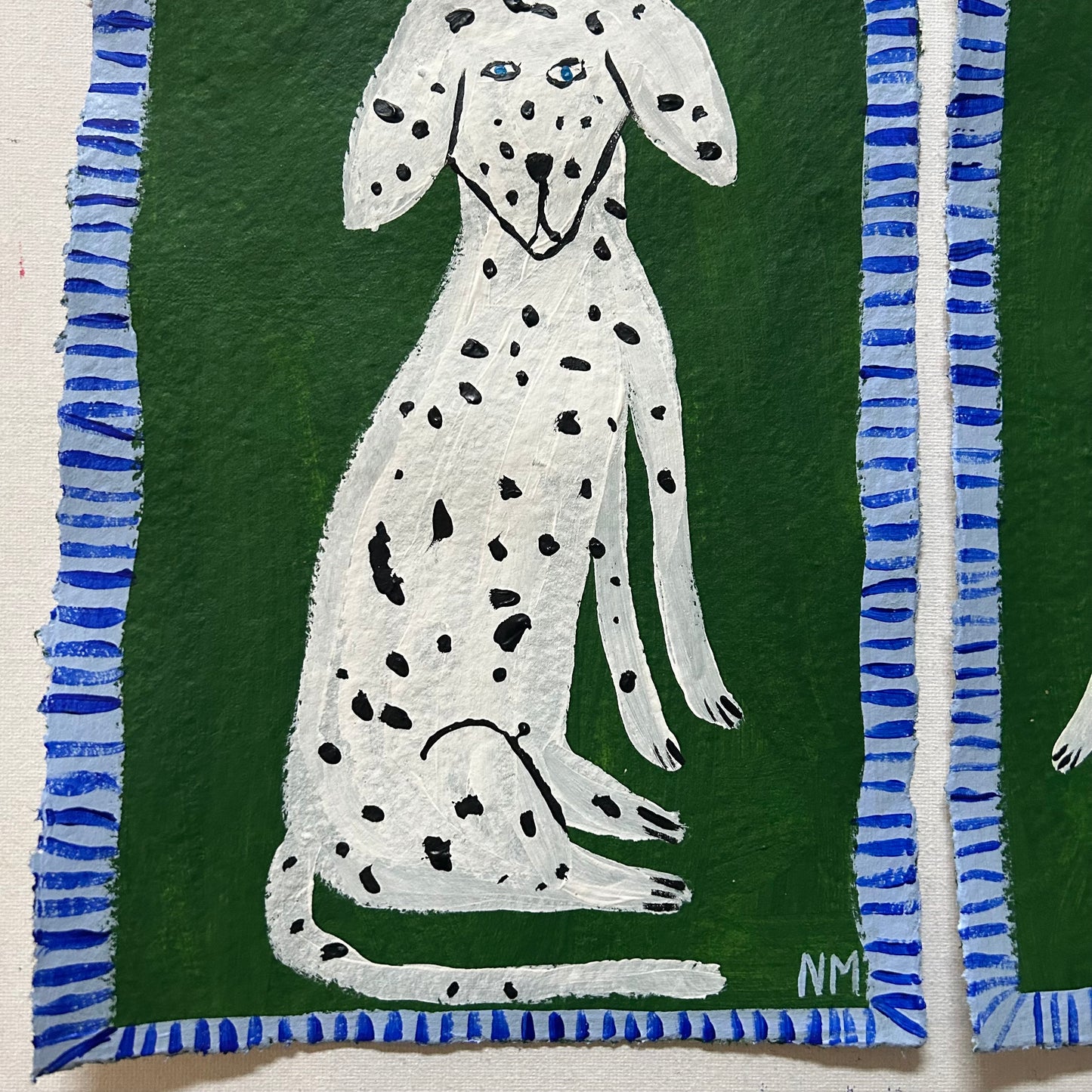 Two Dalmatians on green