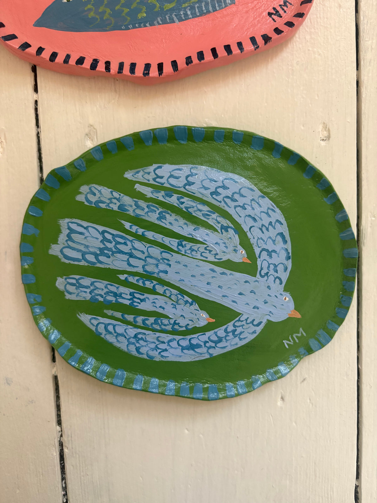 Blue mother bird wall plate.