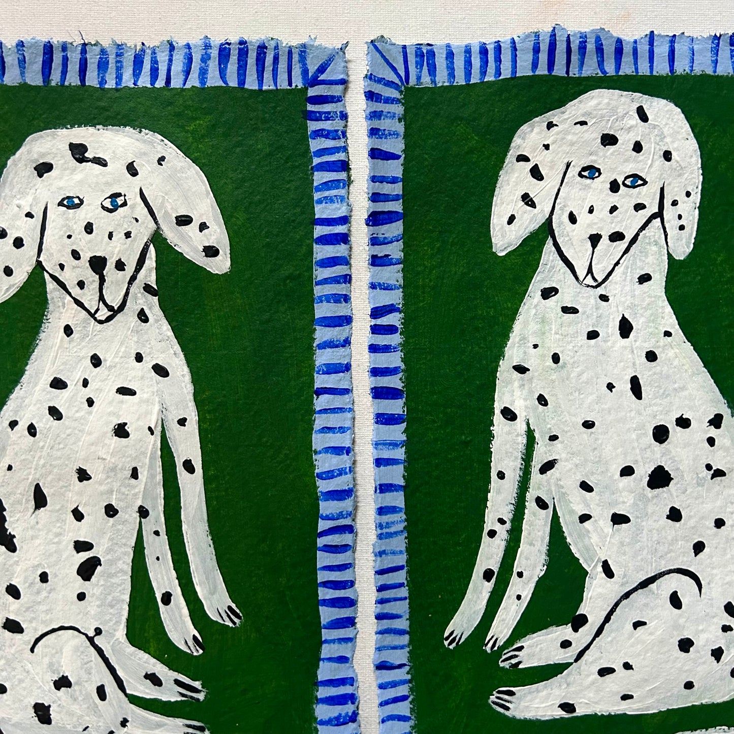 Two Dalmatians on green