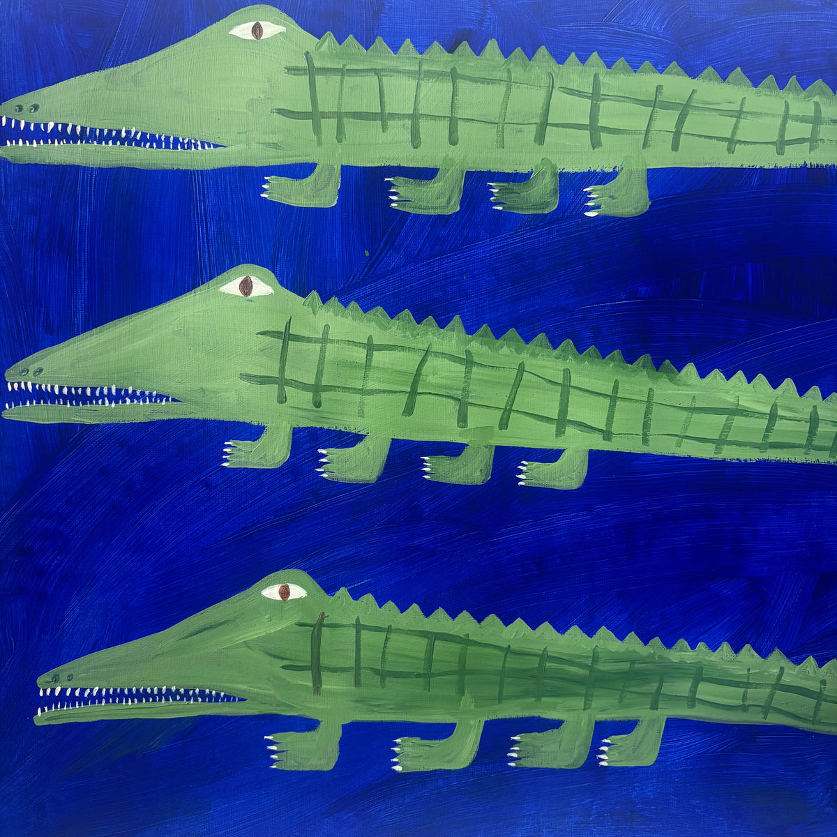 Three green crocodiles.