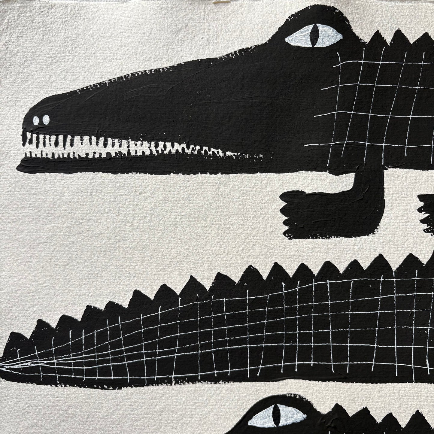 Three black crocodiles.