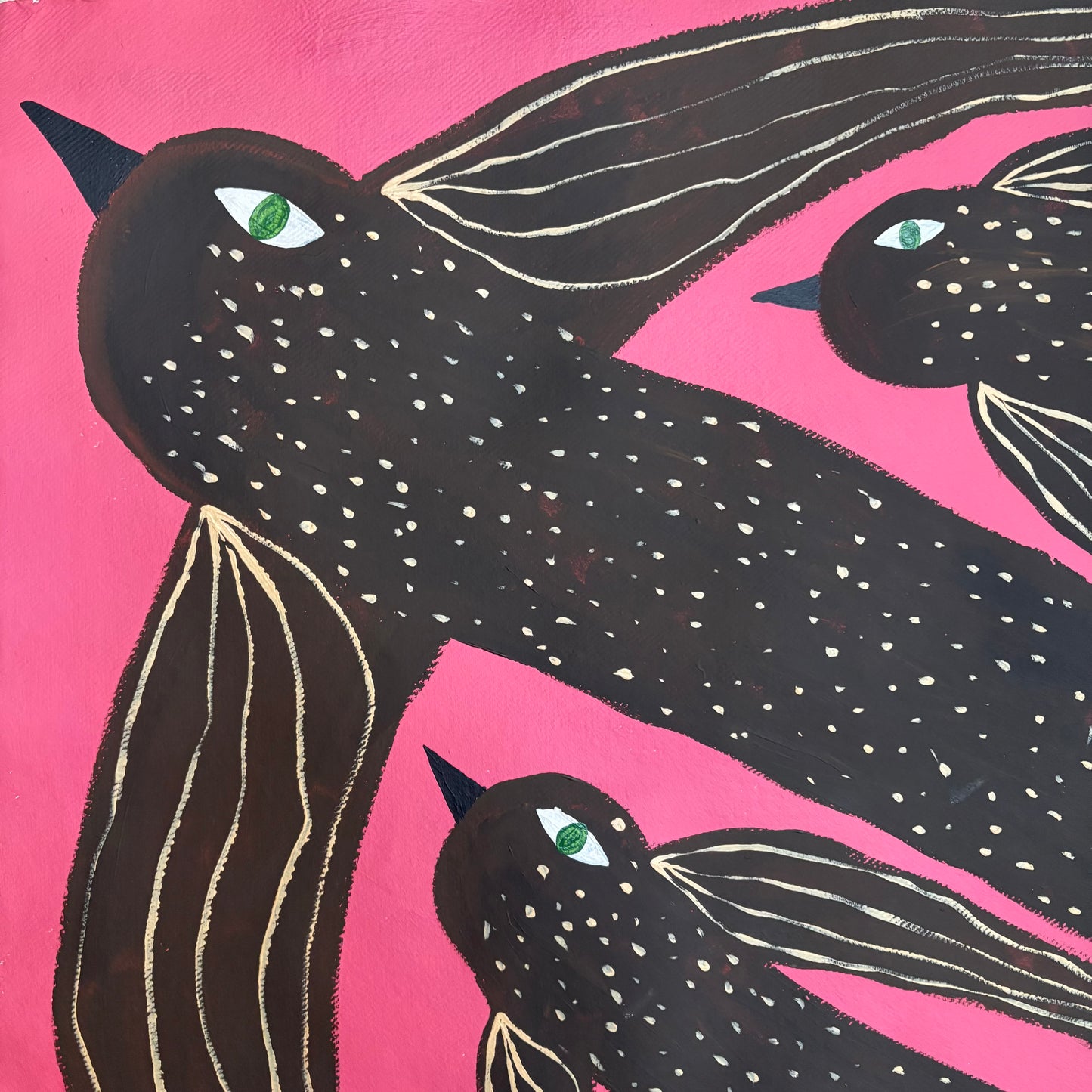 Birds flying in the pink sky.